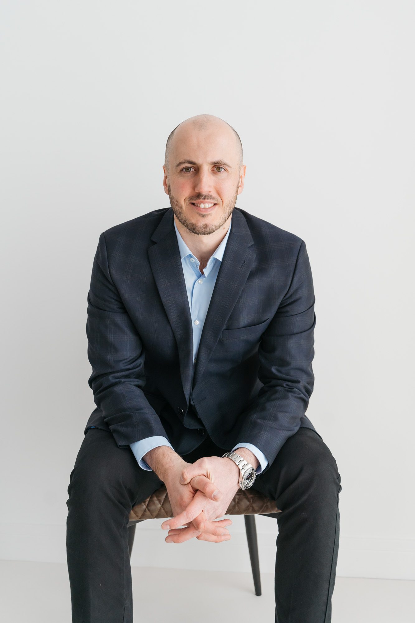 Man in suit sitting on chair