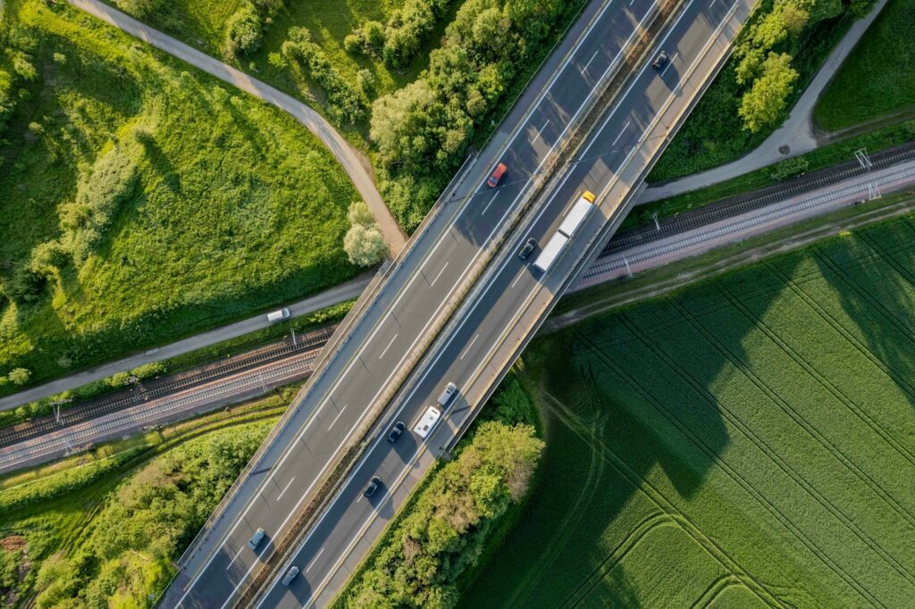 an aerial view of a highway with cars on it